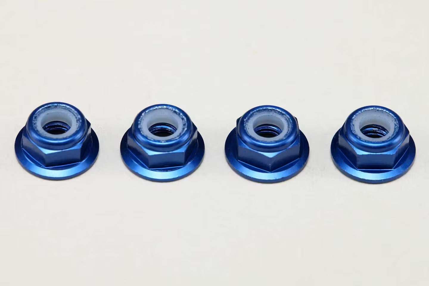 YOKOMO 4MM FLANGE ALLOY NYLON LOCK NUTS - 4PCS - BLUE - ZC-N4AFLBL